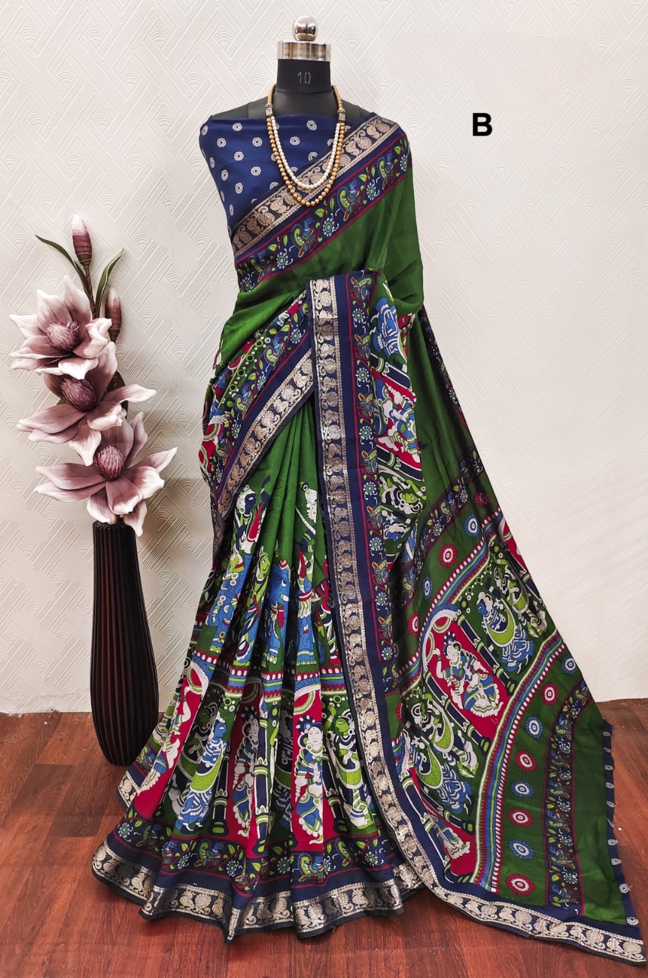 Mangalgiri Madhubani Pattu 
With contrast butti blouse 
And Kanchi weaving borders